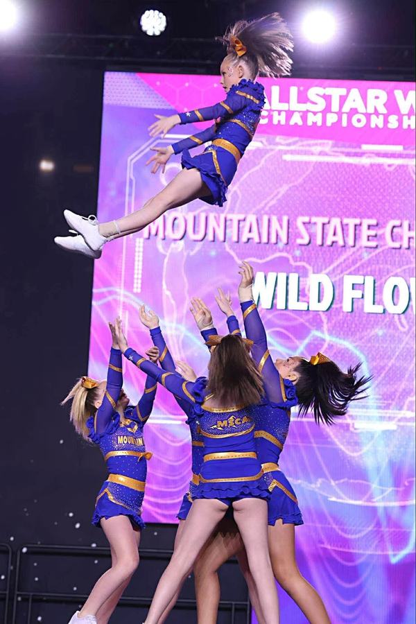 Wildflowers flyer in the air on a basket toss at the Allstar World Championship
