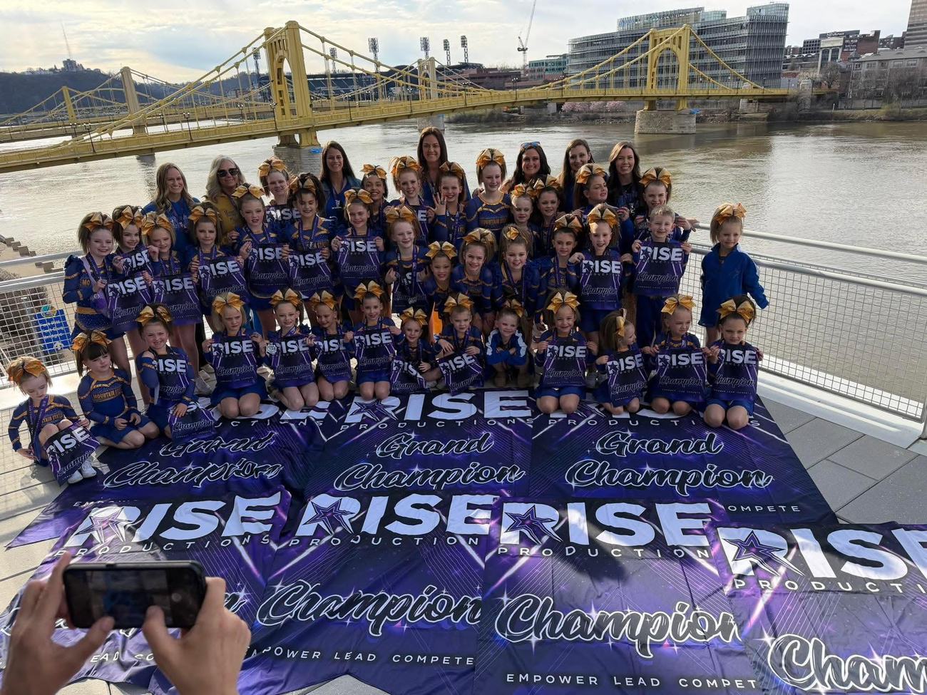 The whole Mountain State family with champion banners on the Pittsburgh riverfront